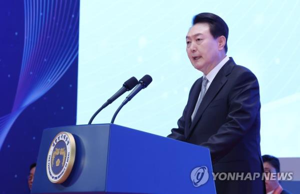 President Yoon Suk Yeol speaks during a ceremony at the COEX exhibition center in Seoul on March 3, 2023, to mark the 57th Taxpayers' Day and present people with presidential citations for being exemplary taxpayers. (Yonhap)