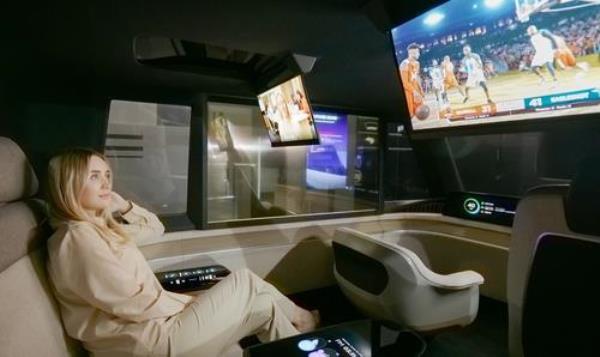 The file photo provided by LG Display Co. on Jan. 5, 2023, shows a passenger watching a sports program on a rollable panel inside the company's auto<em></em>nomous co<em></em>ncept car. (PHOTO NOT FOR SALE) (Yonhap)