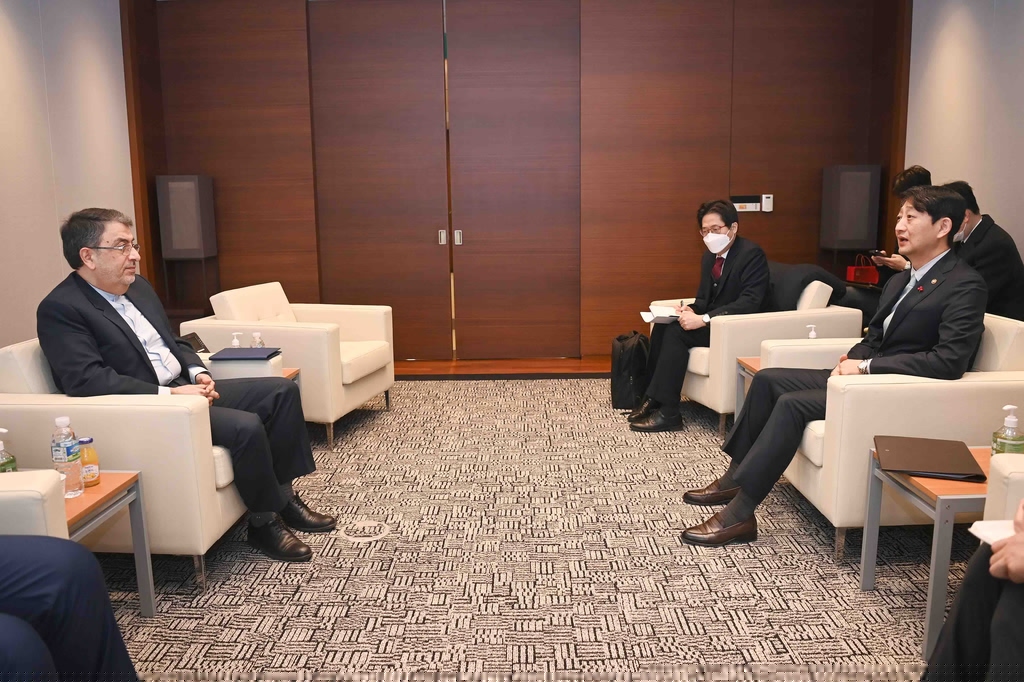 This photo, provided by South Korea's trade ministry shows Minister Ahn Duk-geun (R) speaking with Iran's Ambassador to South Korea Saeed Shabestari (L) in Seoul on Jan. 5, 2023. (PHOTO NOT FOR SALE) (Yonhap) 