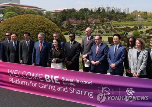 Delegates of the Bureau Internatio<em></em>nal des Expositions pose for a photo during their visit to the United Nations Memorial Cemetery in Busan, 325 kilometers southeast of Seoul, on April 6, 2023. (Yonhap)