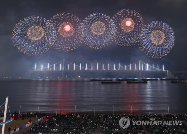 Fireworks are set off above Gwangalli Beach in South Korea's southeastern port city of Busan on April 6, 2023, to promote the city's bid to host the 2030 World Expo. (Yonhap)