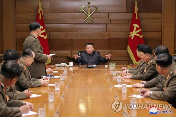 This photo, carried by North Korea's official Korean Central News Agency on April 11, 2023, shows the North's leader Kim Jong-un (C) presiding over an enlarged meeting of the Central Military Commission of the ruling Workers' Party of Korea (WPK) the previous day. (For Use o<em></em>nly in the Republic of Korea. No Redistribution) (Yonhap)