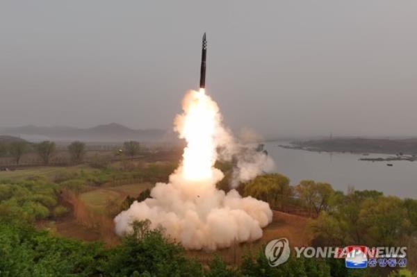 This photo, released by the North's official Korean Central News Agency on April 14, 2023, shows the test-firing of the Hwasong-18 interco<em></em>ntinental ballistic missile the previous day. (For Use o<em></em>nly in the Republic of Korea. No Redistribution) (Yonhap)