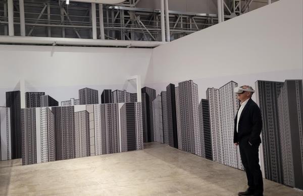 British pop artist Julian Opie poses for a photo at a virtual reality experience zone at K1963, a culture and art space in the southeastern port city of Busan, during a press preview session on May 3, 2023. (Yonhap)
