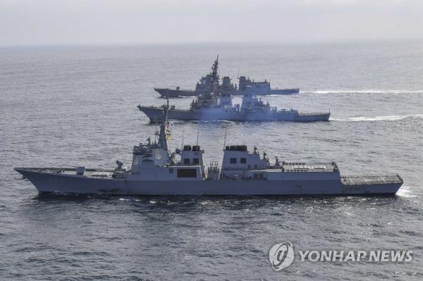 This file photo, released by the South Korean Navy on April 17, 2023, shows three Aegis-equipped destroyers -- the South's Yulgok Yi I (front), the Benfold (C) of the U.S. Navy and the JS Atago of the Japan Maritime Self-Defense Force -- sailing in waters off South Korea's east coast. (PHOTO NOT FOR SALE) (Yonhap)