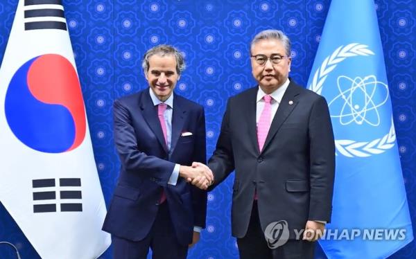 This photo taken July 8, 2023, and provided by the Ministry of Foreign Affairs, shows Foreign Minister Park Jin (R) shaking hands with IAEA Director General Rafael Mariano Grossi ahead of their meeting at the ministry building in Seoul. (Yonhap)