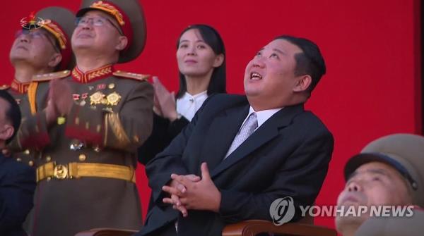 This file image, captured from footage from North Korea's Korean Central Television on Oct. 12, 2021, shows the North's leader Kim Jong-un (2nd from R) and his sister, Kim Yo-jong (C), looking around an exhibition on defense development held in Pyongyang. (Use o<em></em>nly in the Republic of Korea. No Redistribution) (Yonhap)