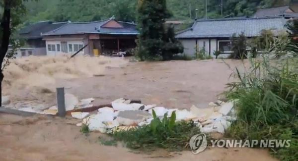 A village in Bonghwa, North Gyeo<em></em>ngsang Province, is flooded by torrential rains on July 15, 2023, in this photo provided by a reader. (PHOTO NOT FOR SALE) (Yonhap)