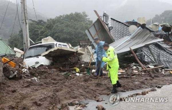 A rescue operation is under way in the county of Yecheon, North Gyeo<em></em>ngsang Province, on July 15, 2023, after a landslide buried five houses. 