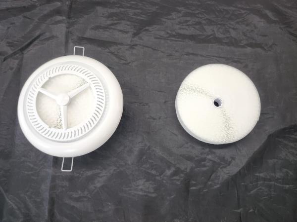 This photo taken July 17, 2023, shows VBolta Filter's air diffuser cover (L) and its filter. (Yonhap)
