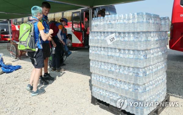 Bottles of water are stacked on the campsite for the World Scout Jamboree in the Saemangeum reclamation area on South Korea's southwest coast on Aug. 6, 2023. (Yonhap)