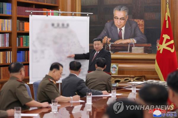 This photo, carried by the North's Korean Central News Agency on Aug. 10, 2023, shows North Korean leader Kim Jong-un presiding over an enlarged meeting of the Central Military Commission of the ruling Workers' Party of Korea the previous day. (For Use o<em></em>nly in the Republic of Korea. No Redistribution) (Yonhap)