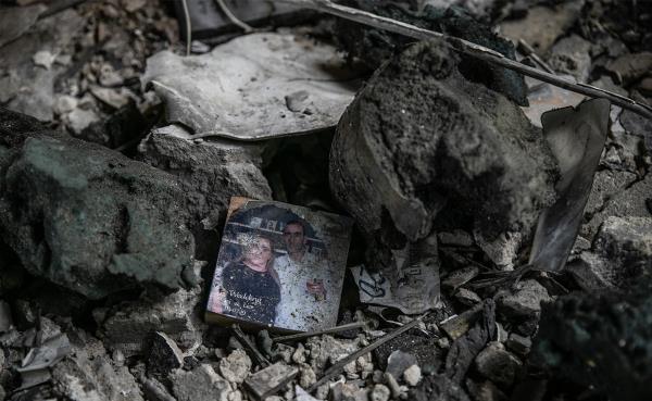 A woman breaks down after Israeli fighter jets destroyed a building following the Operation Al-Aqsa Flood launched by Hamas in Rafah.