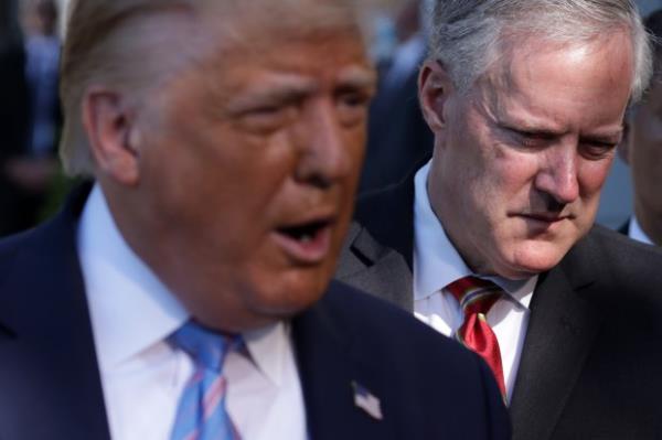 Then-President Do<em></em>nald Trump speaks as White House Chief of Staff Mark Meadows listens prior to Trump's Marine One departure from the South Lawn of the White House July 29, 2020 in Washington, DC. (Alex Wong/Getty Images)