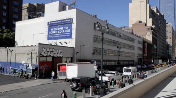 Real estate of the Touro College building located at 320W 31st Street in Midtown Manhattan. The building was being used to house single male migrants, but earlier today October 23, 2023, State and FDNY Fire Marshalls shut down the makeshift shelter. It's unclear how the building became a shelter and who authorized without FDNY approval. (Luiz C. Ribeiro for NY Daily News)